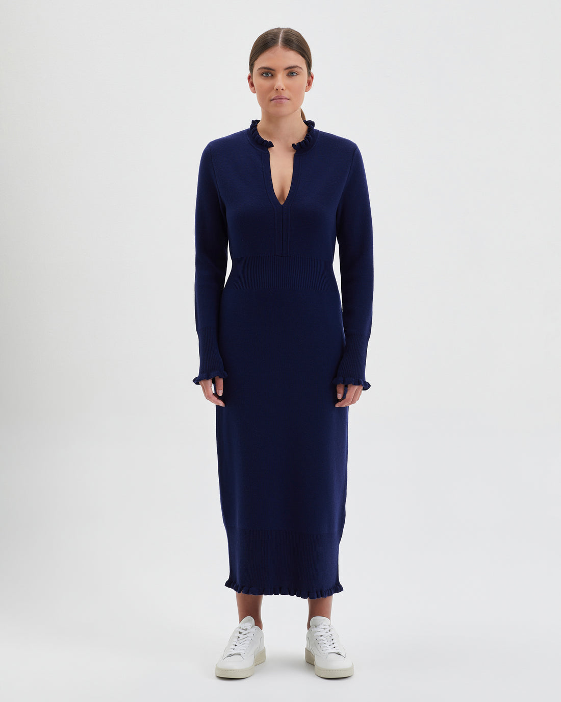 Navy Little River Knit Dress with elegant ruffles on cuffs and neckline.