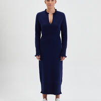Navy Little River Knit Dress with elegant ruffles on cuffs and neckline.