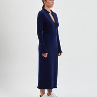 Navy merino wool knit dress with flattering, streamlined silhouette.