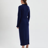 Back view of the navy wool little river dress with romantic frills.