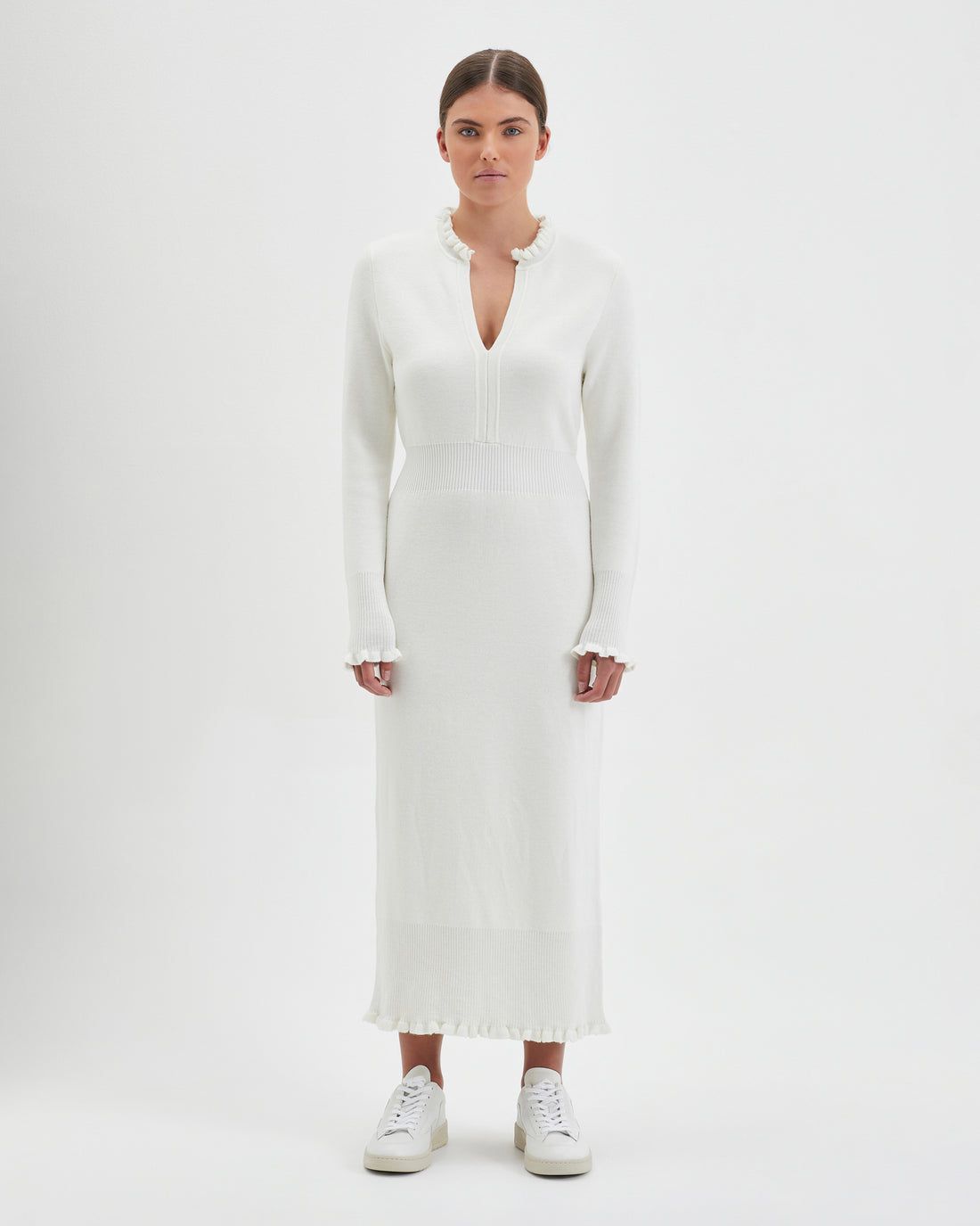 Ivory Little River Knit Dress with ruffled cuffs and neckline.
