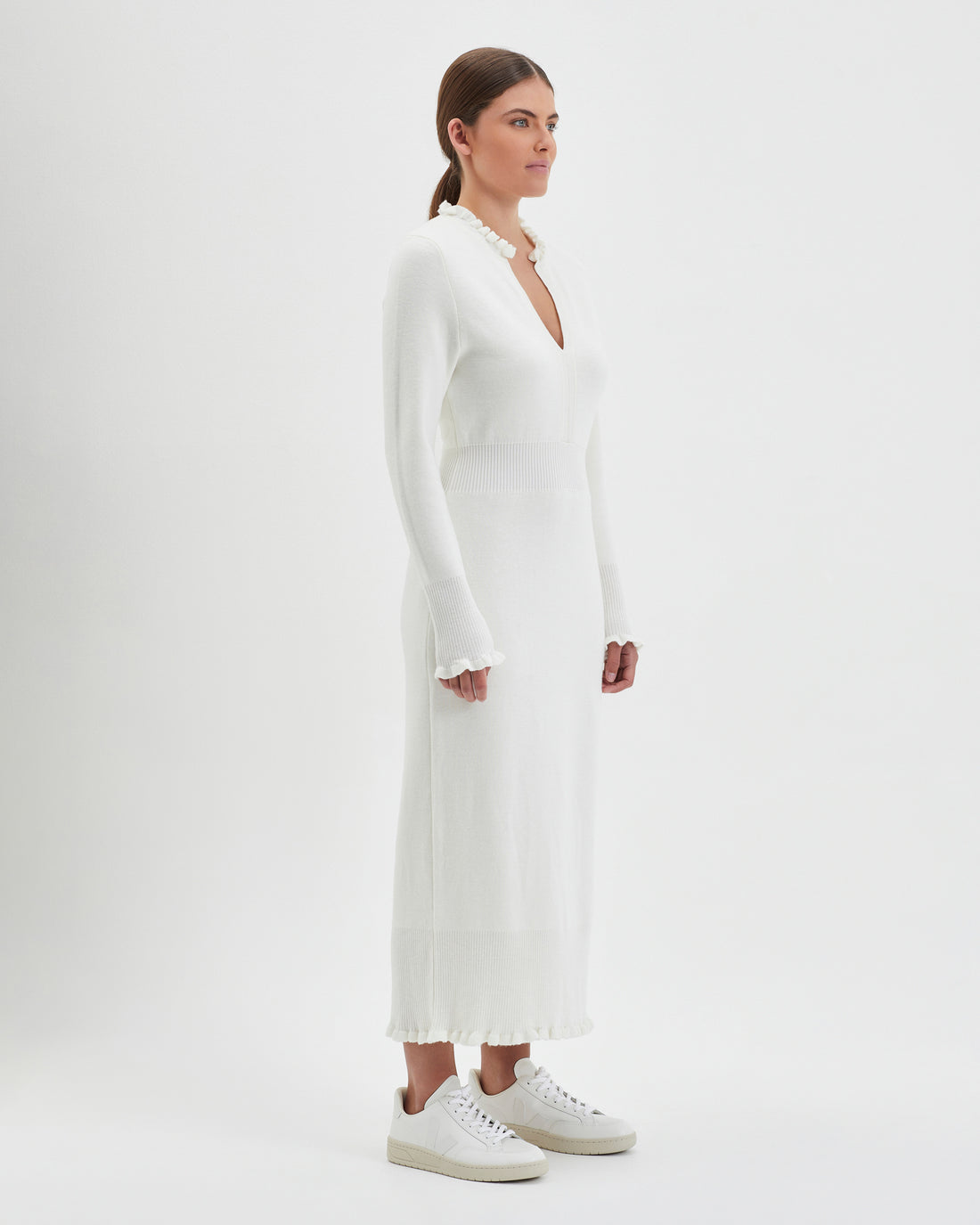 Merino wool knit dress in ivory with a flattering, fitted silhouette.