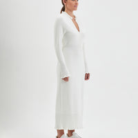 Merino wool knit dress in ivory with a flattering, fitted silhouette.