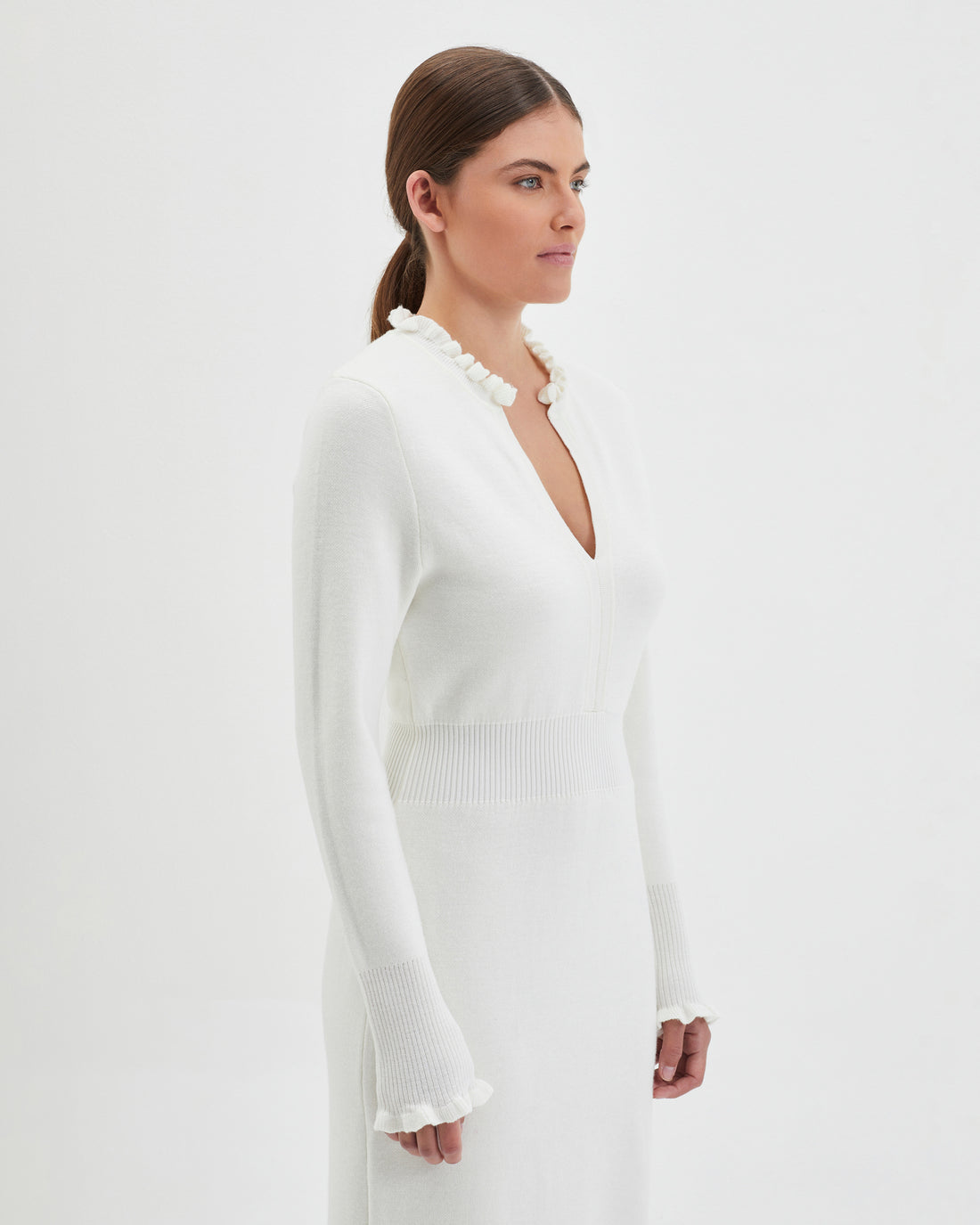 Romantic ivory wool dress crafted for timeless style.