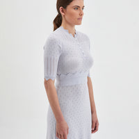 Elegant scalloped sleeve details on pearl-colored Pointelle Knit Dress.