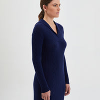 Merino wool knit dress in navy, showcasing refined cable pattern.