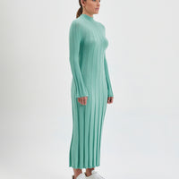 Cozy wool dress in sage, crafted for comfort and elegance.