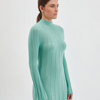 Elegant merino wool knit dress in sage, perfect for winter style.