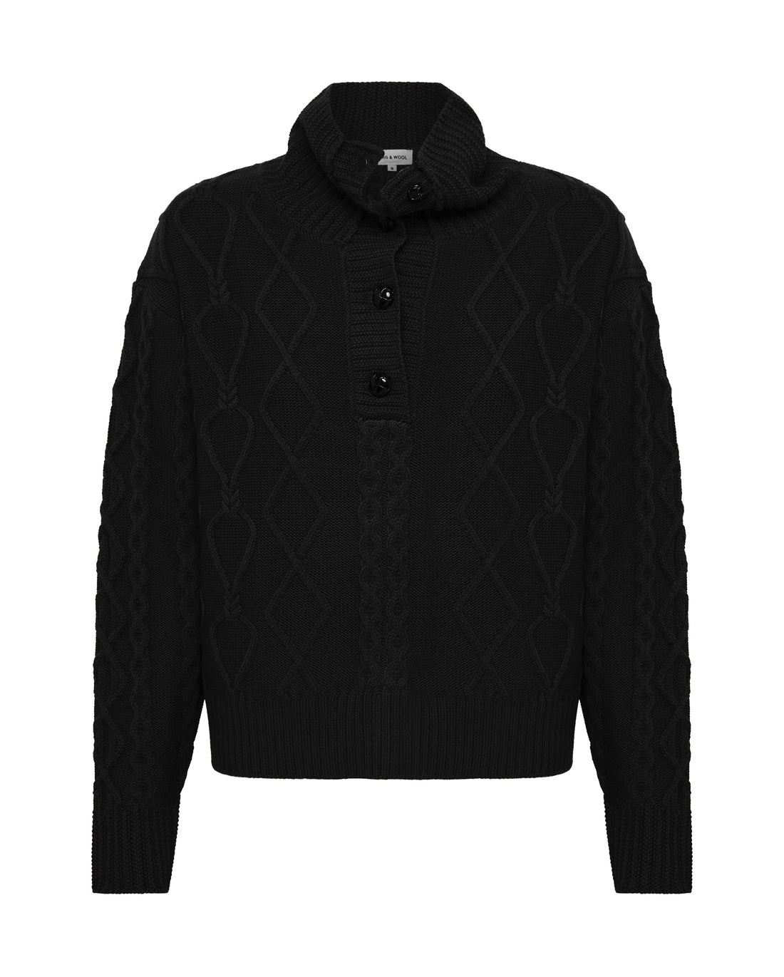 Close-up of Black Wool Sweater – soft, breathable, and refined cable-knit texture