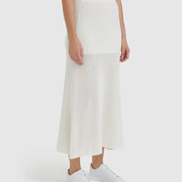 Close-up of cream maxi wool skirt with intricate pointelle detailing.