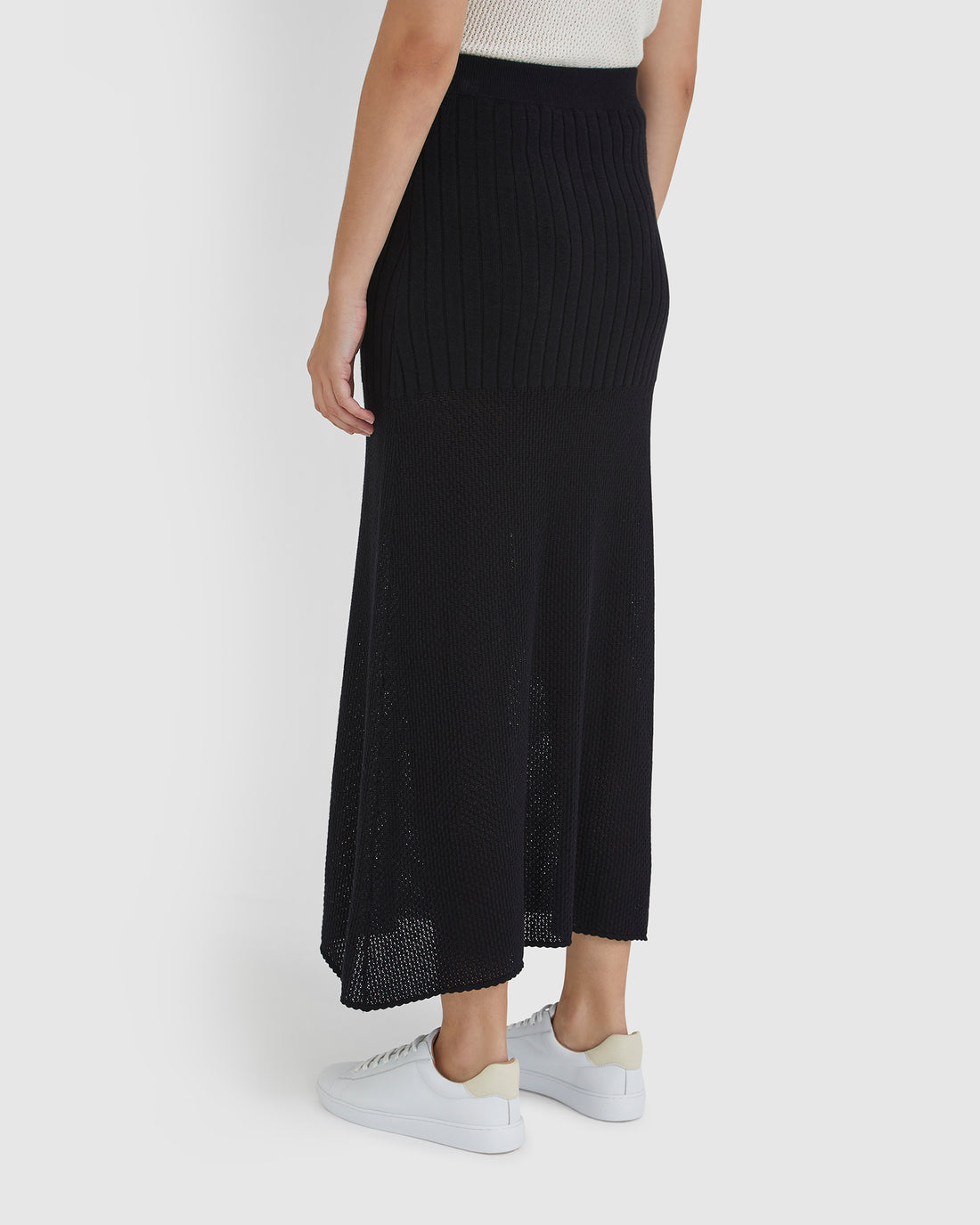 Long black wool skirt, ideal for pairing with the Ruby Top for a chic, coordinated outfit.