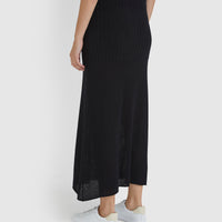 Long black wool skirt, ideal for pairing with the Ruby Top for a chic, coordinated outfit.