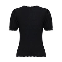 Close-up of back view of the black Ruby Pointelle merino wool and cotton top with classic crew neckline.
