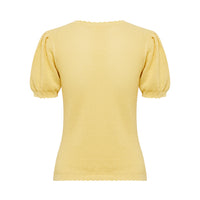 Close up back view of maize Ruby Pointelle top with scalloped trims and intricate detailing.