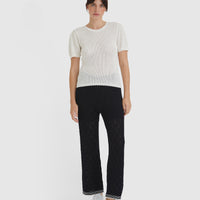 Versatile cream merino wool and cotton top with classic crew neckline and detailed knit.