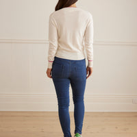 Back view of Mia jeans in merino wool blend with classic skinny fit and Iris and Wool embroidery.