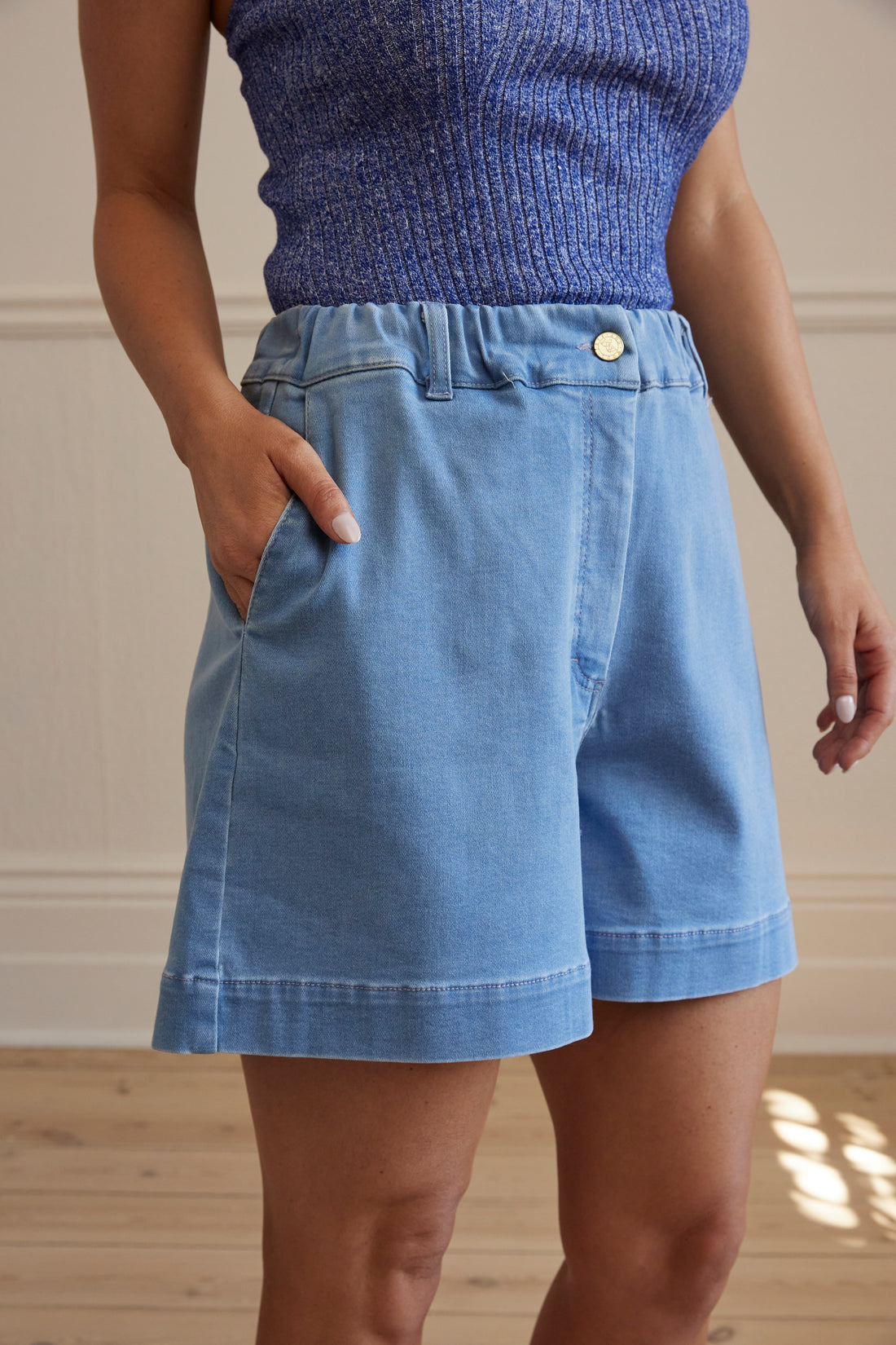 Alice wool denim shorts with mid-length cut and gold hardware.