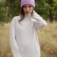 Cherry Blossom merino wool beanie with cable-knit design for women.