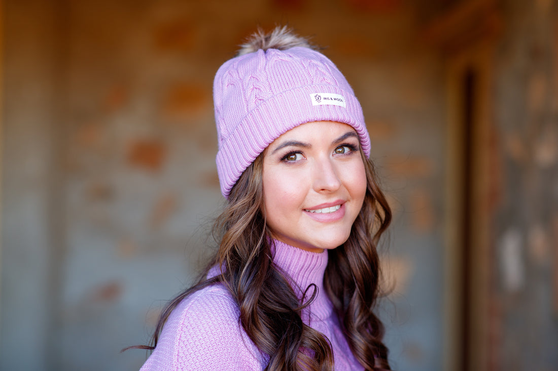 Close-up of cable-knit wool beanie in Cherry Blossom, made from premium merino wool.