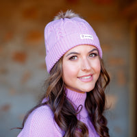 Close-up of cable-knit wool beanie in Cherry Blossom, made from premium merino wool.