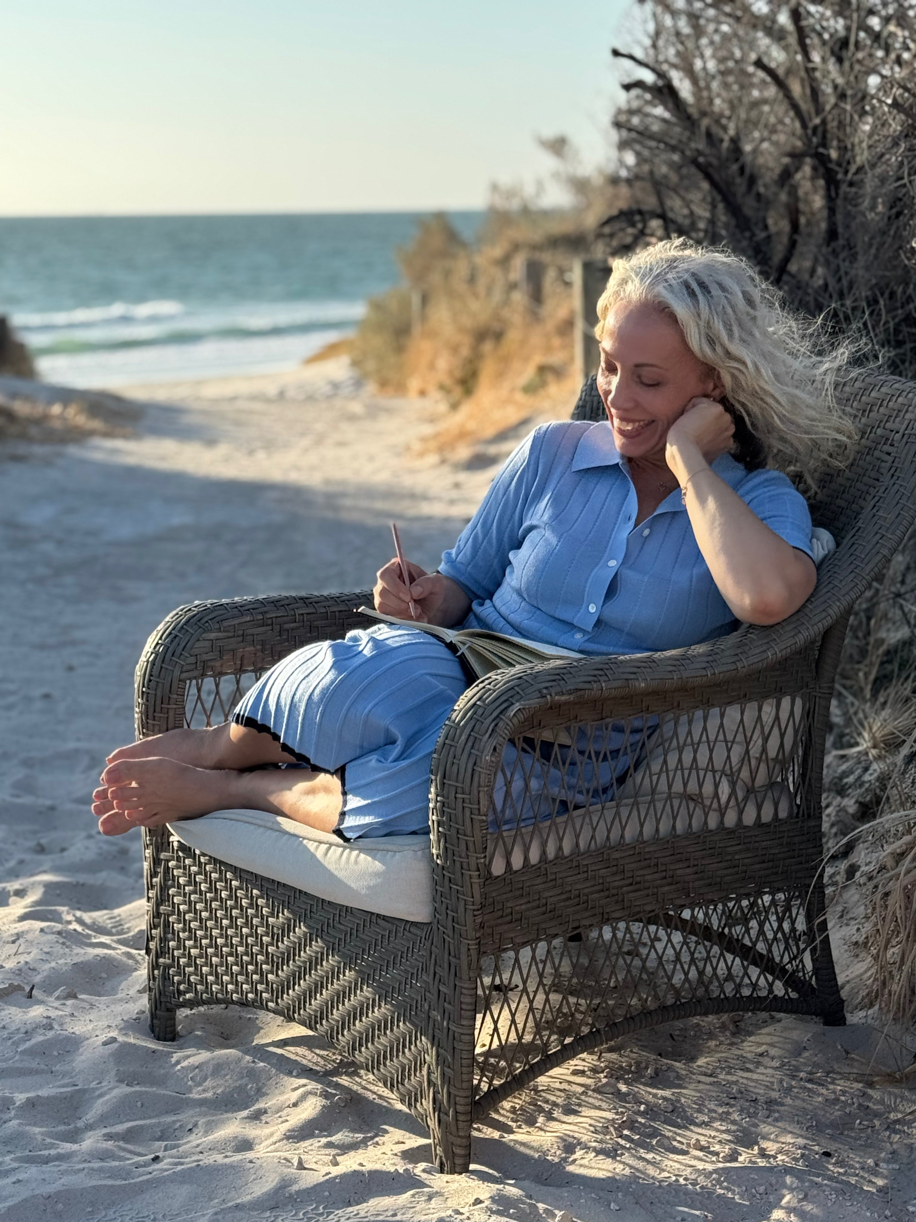 Sustainable fashion meets effortless style as Liz Cook takes in the coastal views in a cozy knit set.