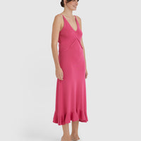 Elegant merino wool dress in pomegranate with fluted frill hem.