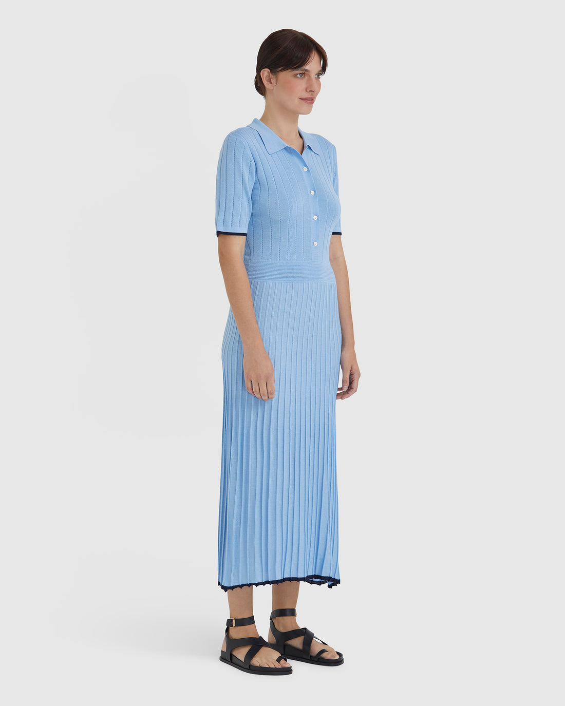 Lightweight merino wool knit dress in sky blue with mother-of-pearl buttons.