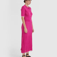 Merino wool dress in cerise with mother-of-pearl buttons for refined style.