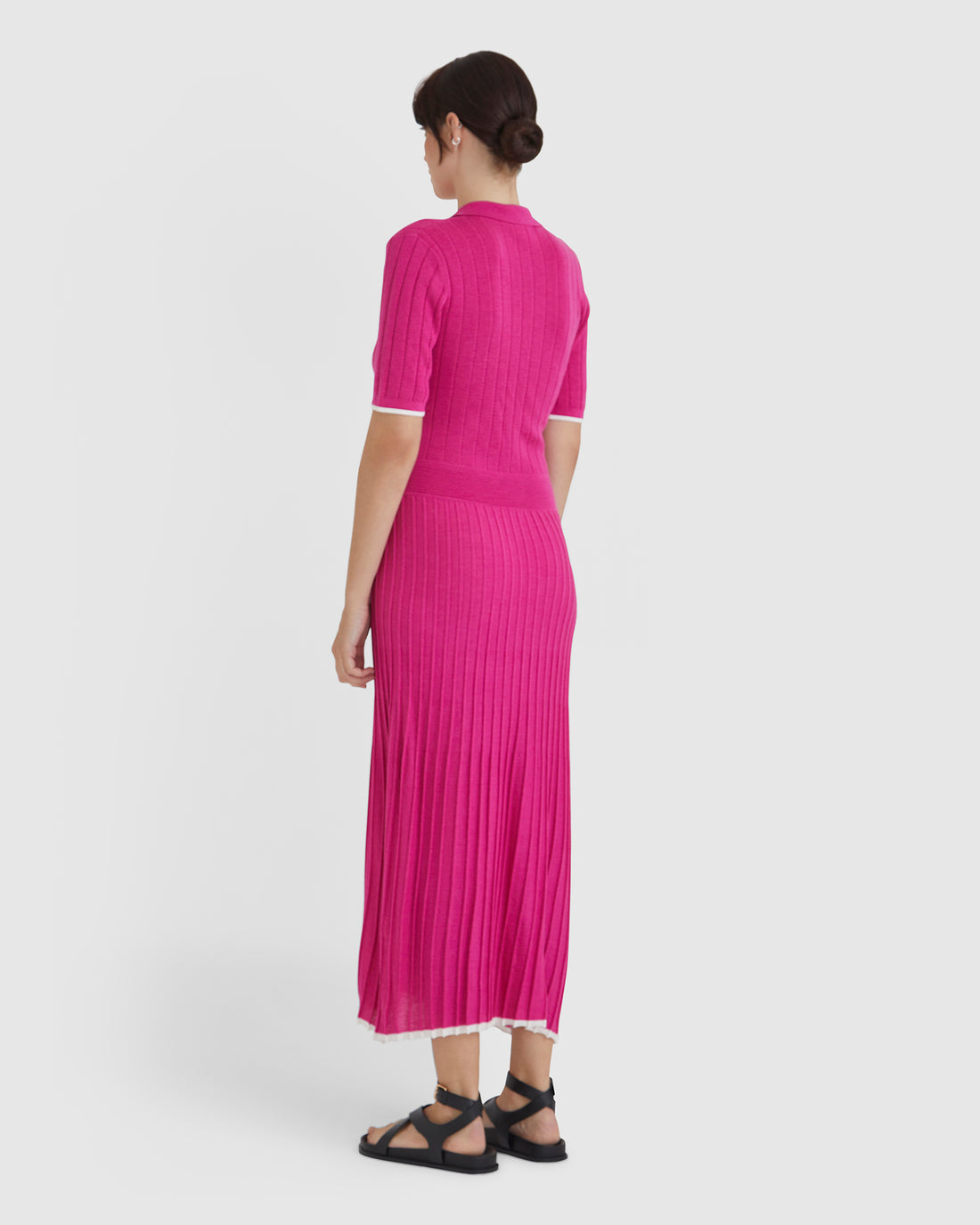 Chic wool knit dress in cerise, combining sporty and elegant elements.