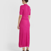 Chic wool knit dress in cerise, combining sporty and elegant elements.