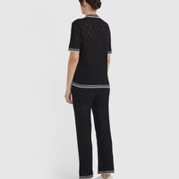 Back view of the black lace top by Iris and Wool.