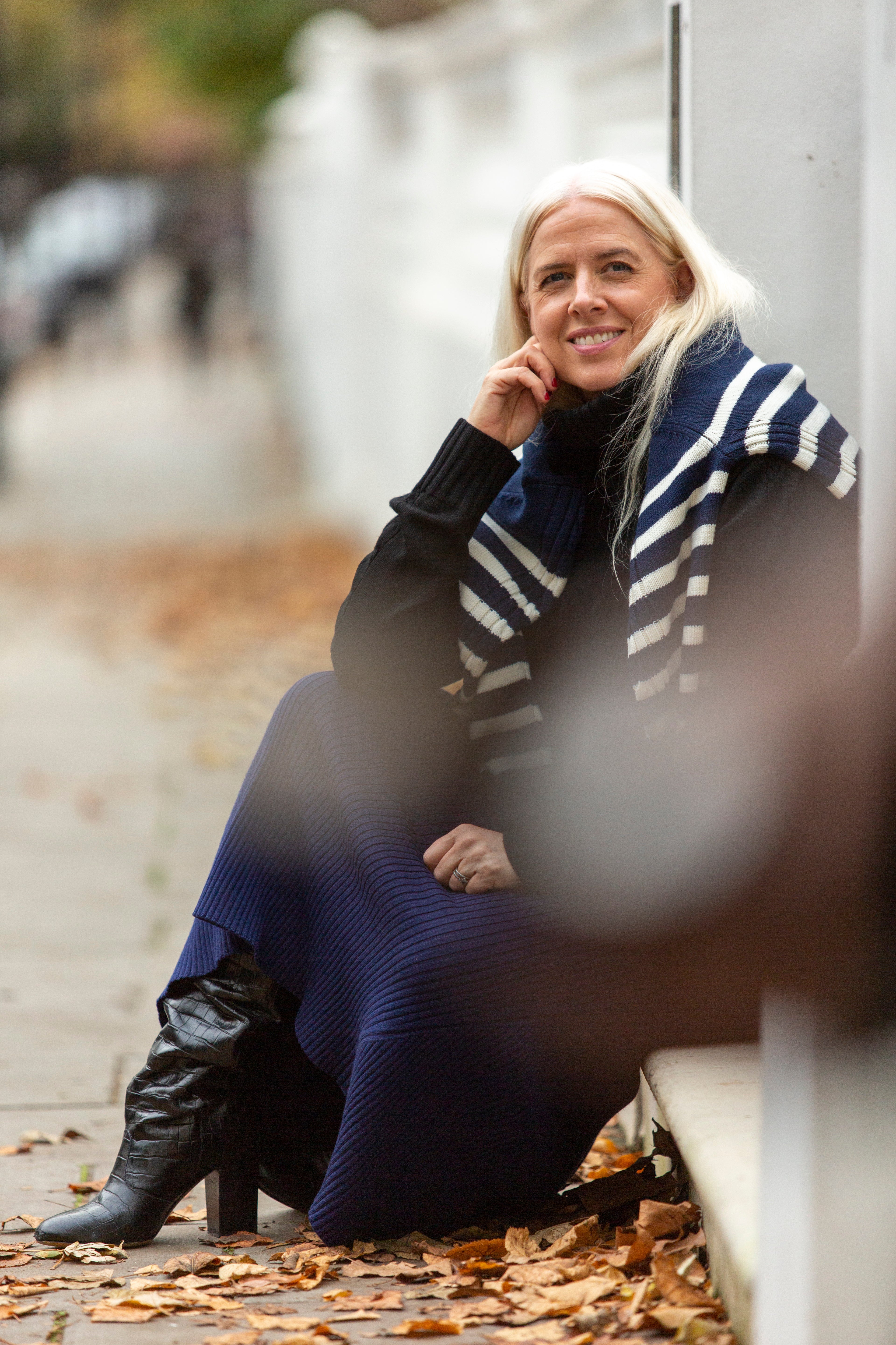 Sustainable fashion in focus - Emily Fitch-Miller styles a neutral-toned knit sweater for a timeless look.