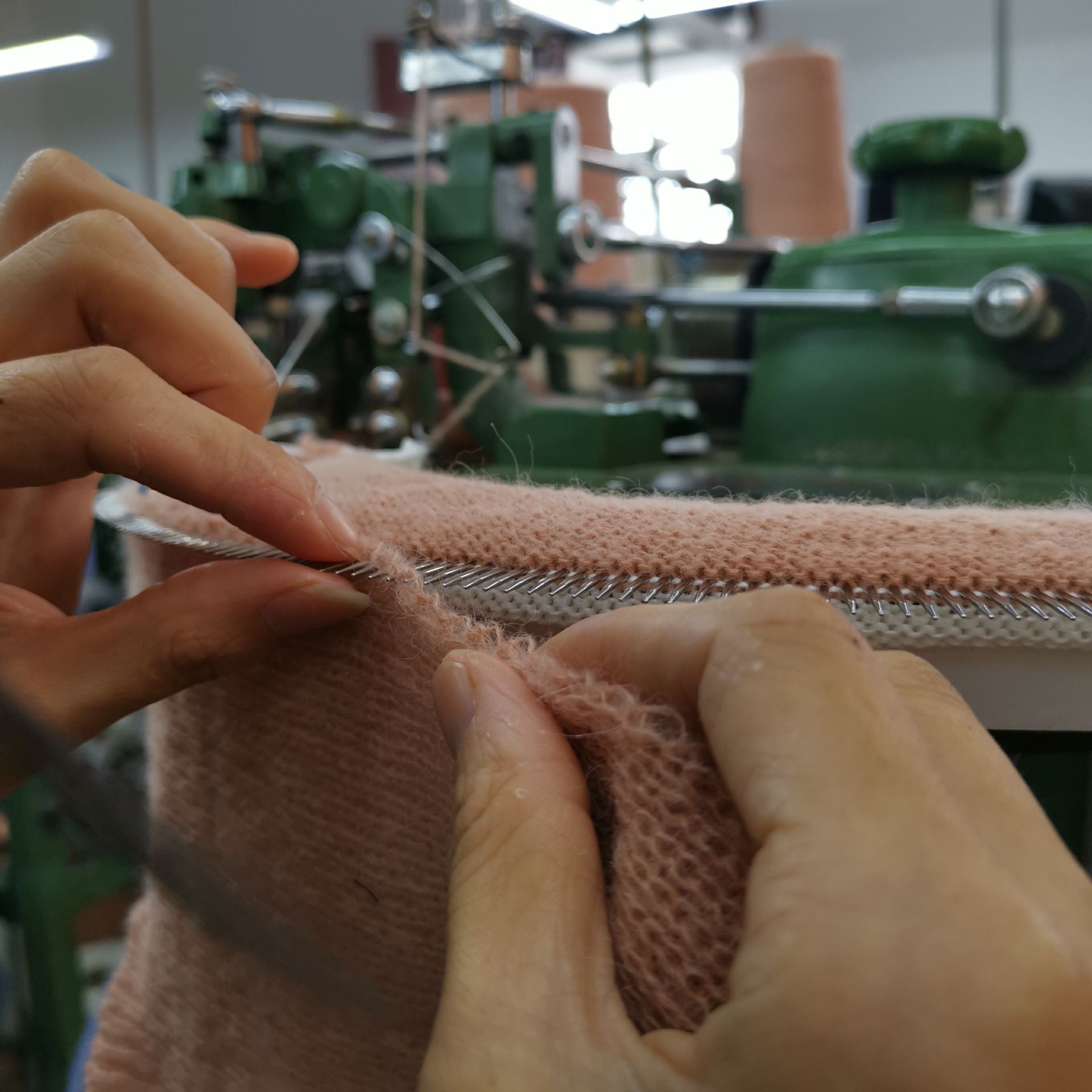 An artisan crafting Australian Merino wool clothing for Iris & Wool, highlighting sustainable fashion and ethical production.