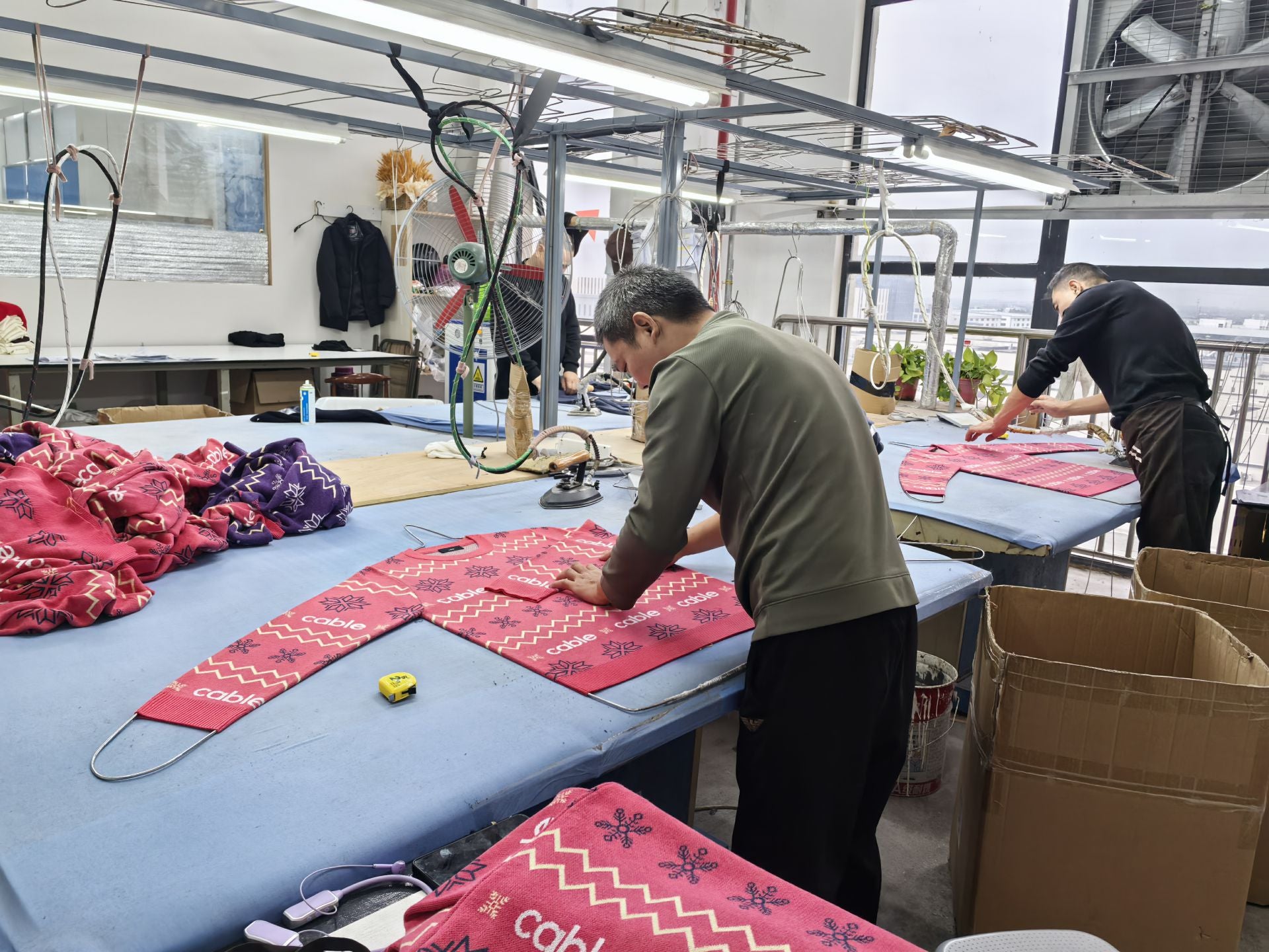 Iris & Wool’s supplier carefully crafting Australian Merino wool garments, highlighting ethical production and sustainable fashion.