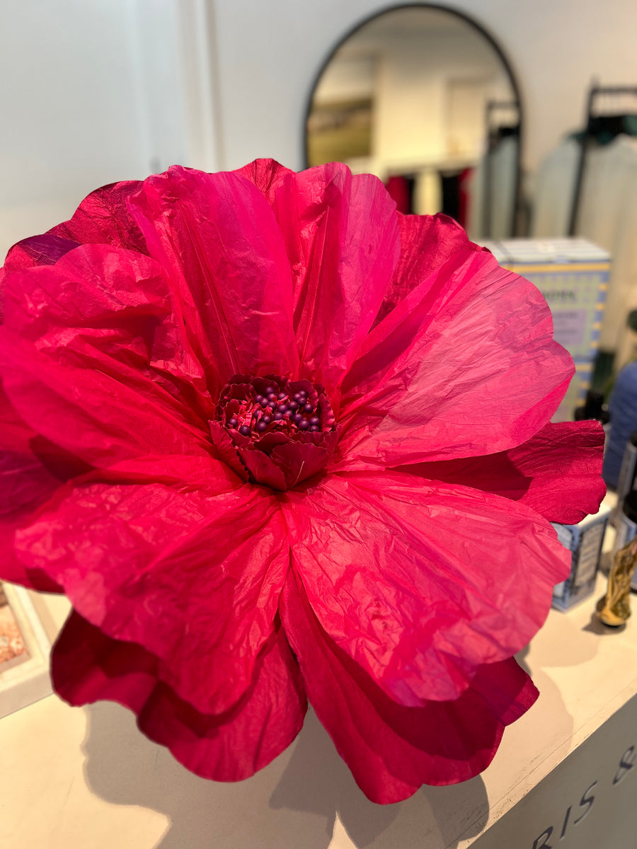 Giant paper flower in red with handcrafted petals for versatile display.