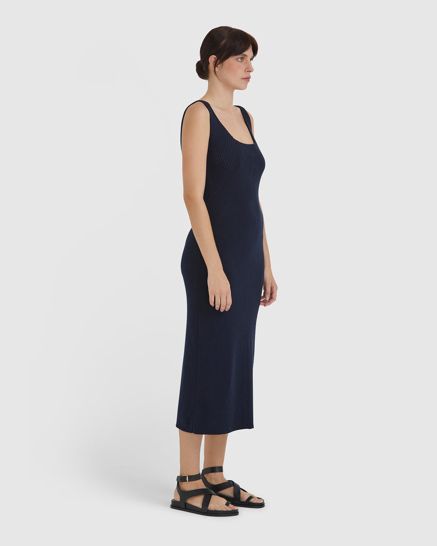 Minimalist merino wool dress in navy, ideal for modern style.