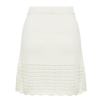 back view of mini crochet white skirt. 