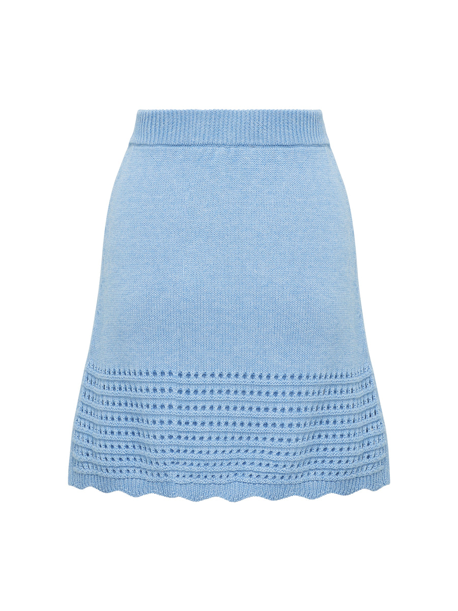 Back view of wool mini skirt in sky blue with scallop and pointelle details.