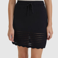 Black crochet mini skirt with drawstring waist and scalloped edges.