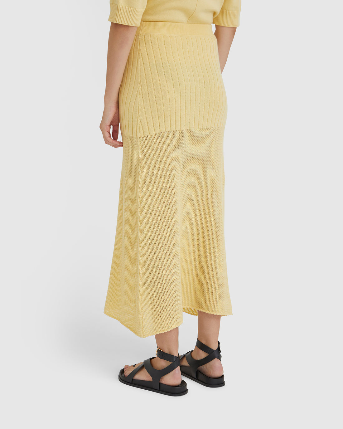 Long wool skirt in maize, ideal for pairing with the Ruby Top for a coordinated look.